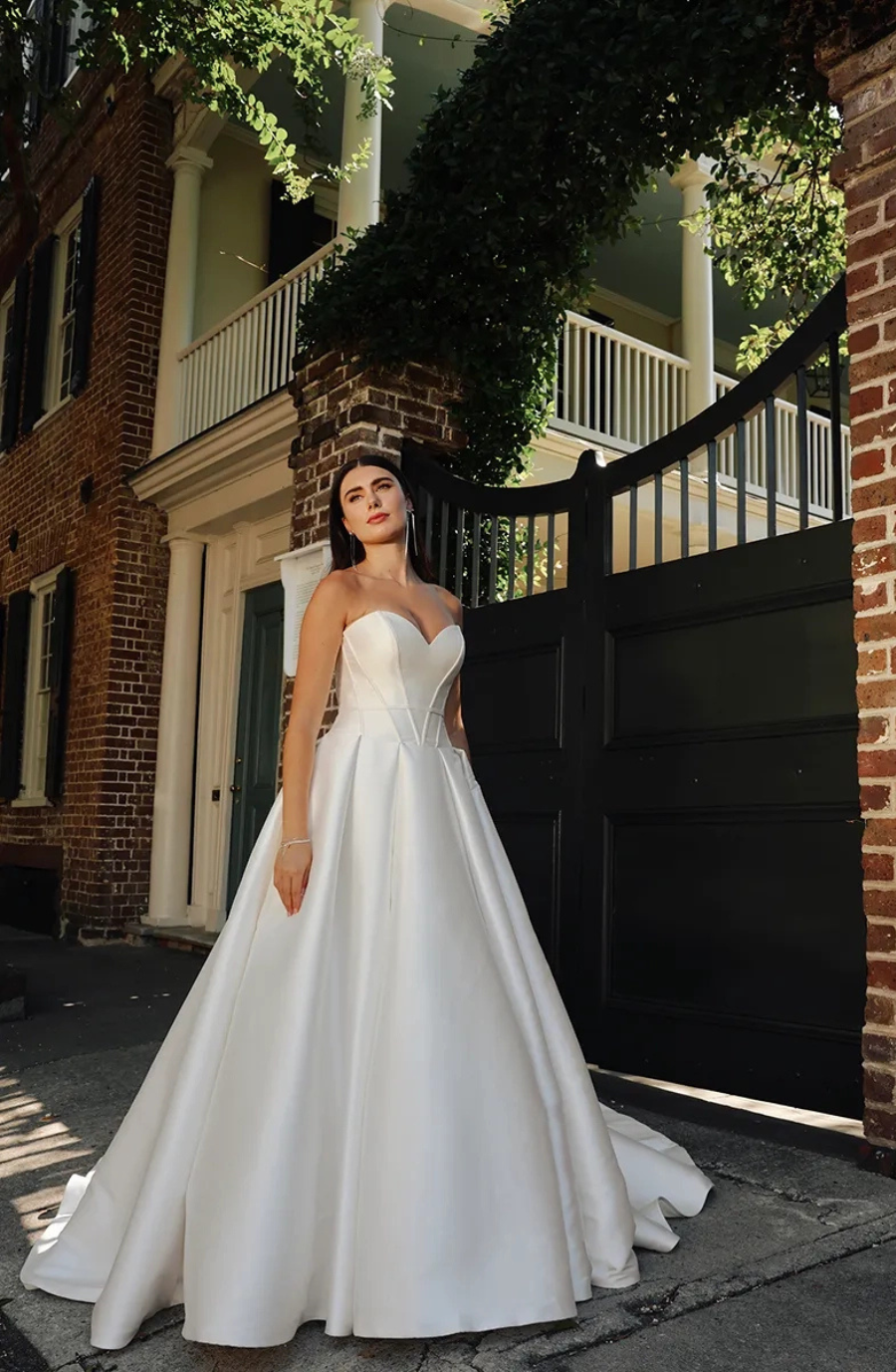 Chic crepe sheath dress with a square neckline and detachable long sleeves, available in ivory or black.
