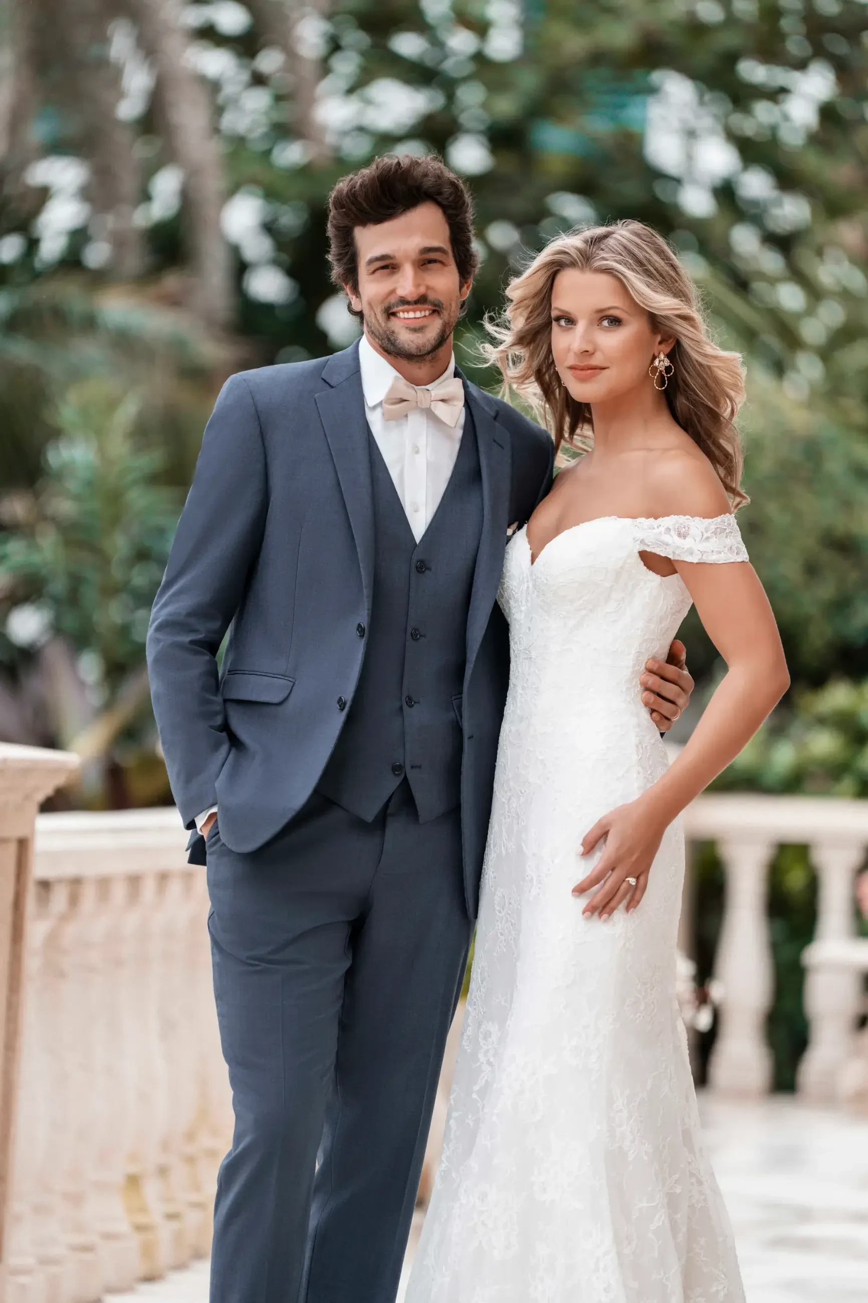 model is wearing an off the shoulder bridal gown