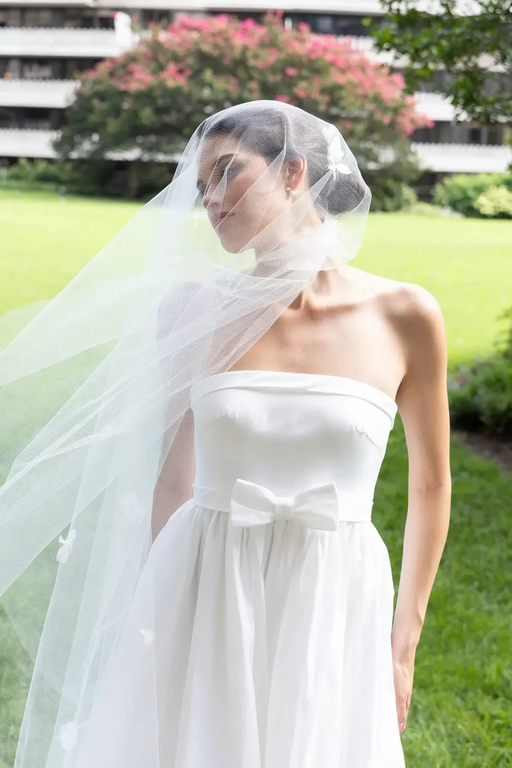 model is wearing a strapless wedding gown