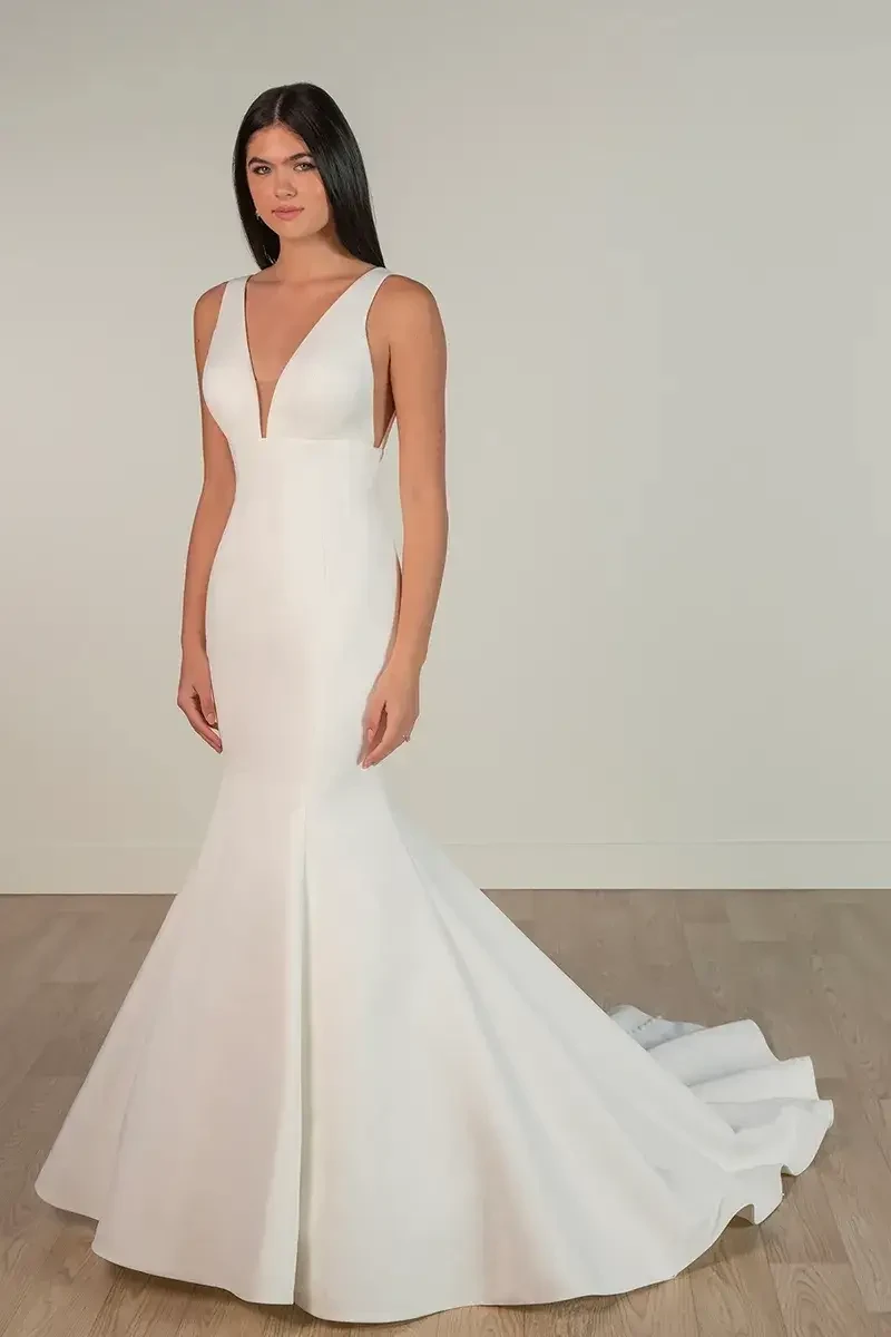 model is wearing a sleeveless mermaid wedding dress