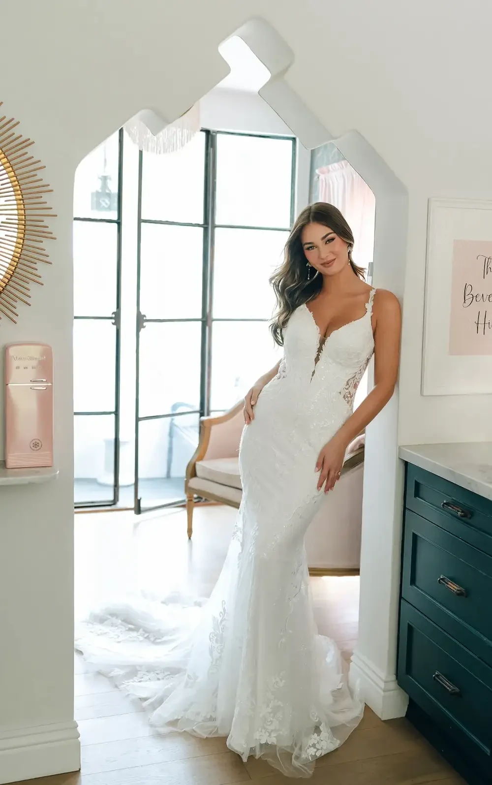 model is wearing a sleeveless bridal gown by stella york